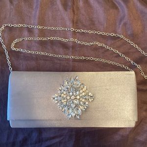 INC satiny silver jeweled clutch